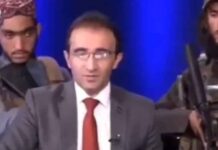 Con dos ametralladoras en la espalda, periodista de la TV afgana informó que está “todo tranquilo”